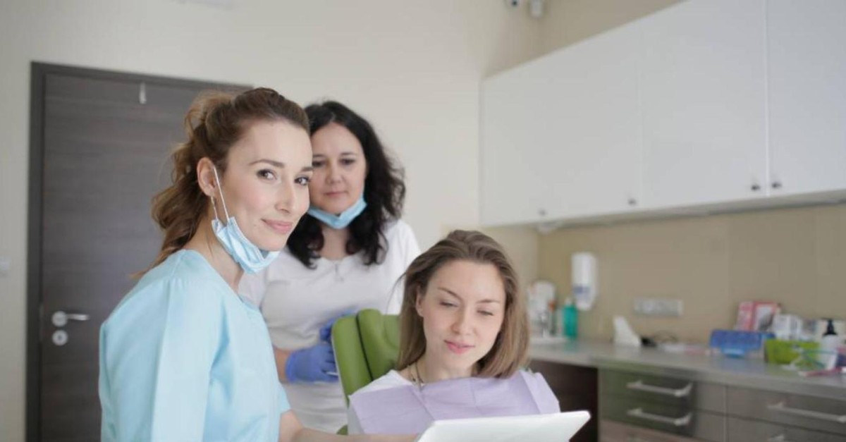 Orthodontic team reviewing a treatment plan together with a patient
